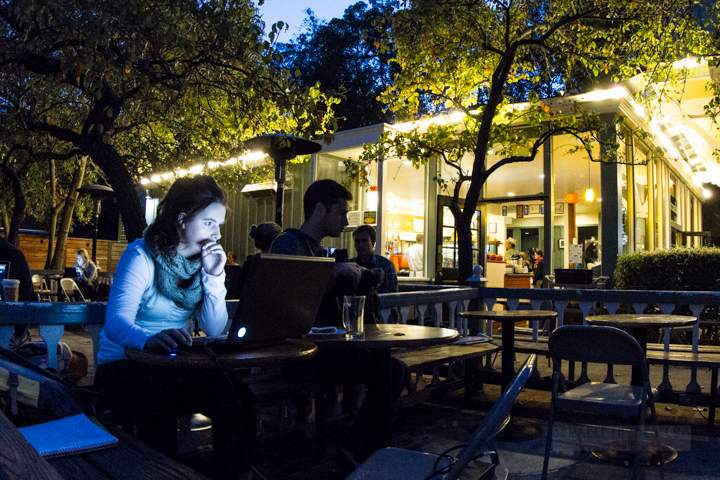 Cafe Strada - Bancroft and College Avenue - Woman studying at night berkeley-california-uc-university-california-southside-cafe-strada-2300-college-avenue-night-people-laptop-glow-1-2