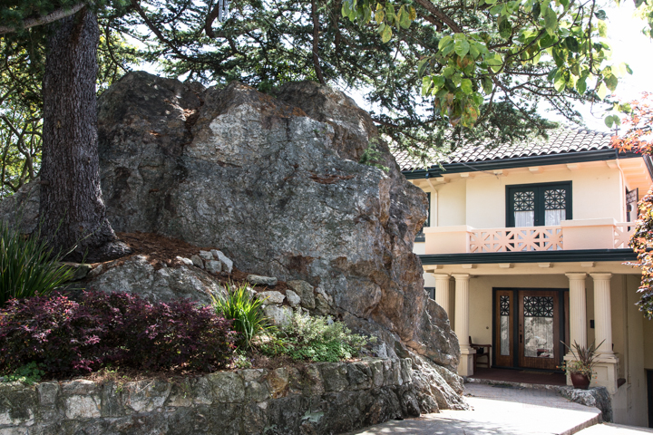 A giant rock in front of a grand home on Menlo Place in Berkeley's Thousand Oaks Neighborhood berkeley-ca-thousand-1000-oaks-neighborhood-homes-c-07